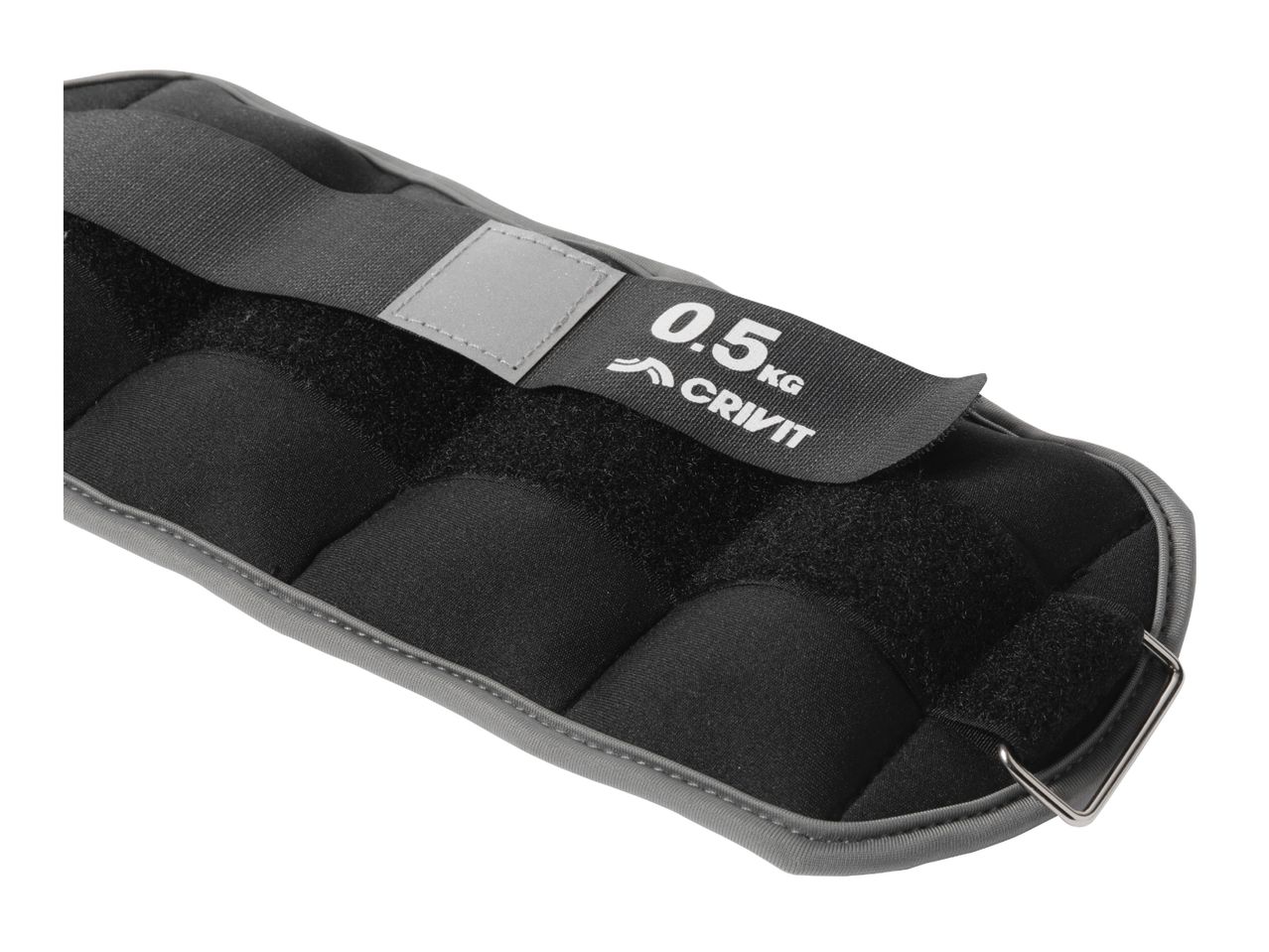 Close-up of a black ankle weight with a grey trim, showing a reflective patch and '0.5 KG' text.