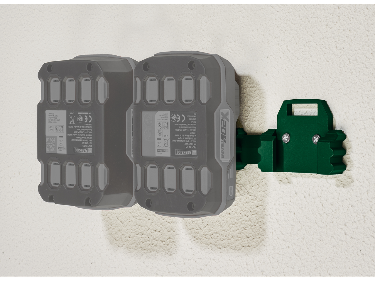 Two Parkside X20V Team batteries mounted on a wall bracket.