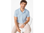 Bărbat zâmbitor purtând un tricou polo albastru deschis ESMARA MEN și pantaloni bej.