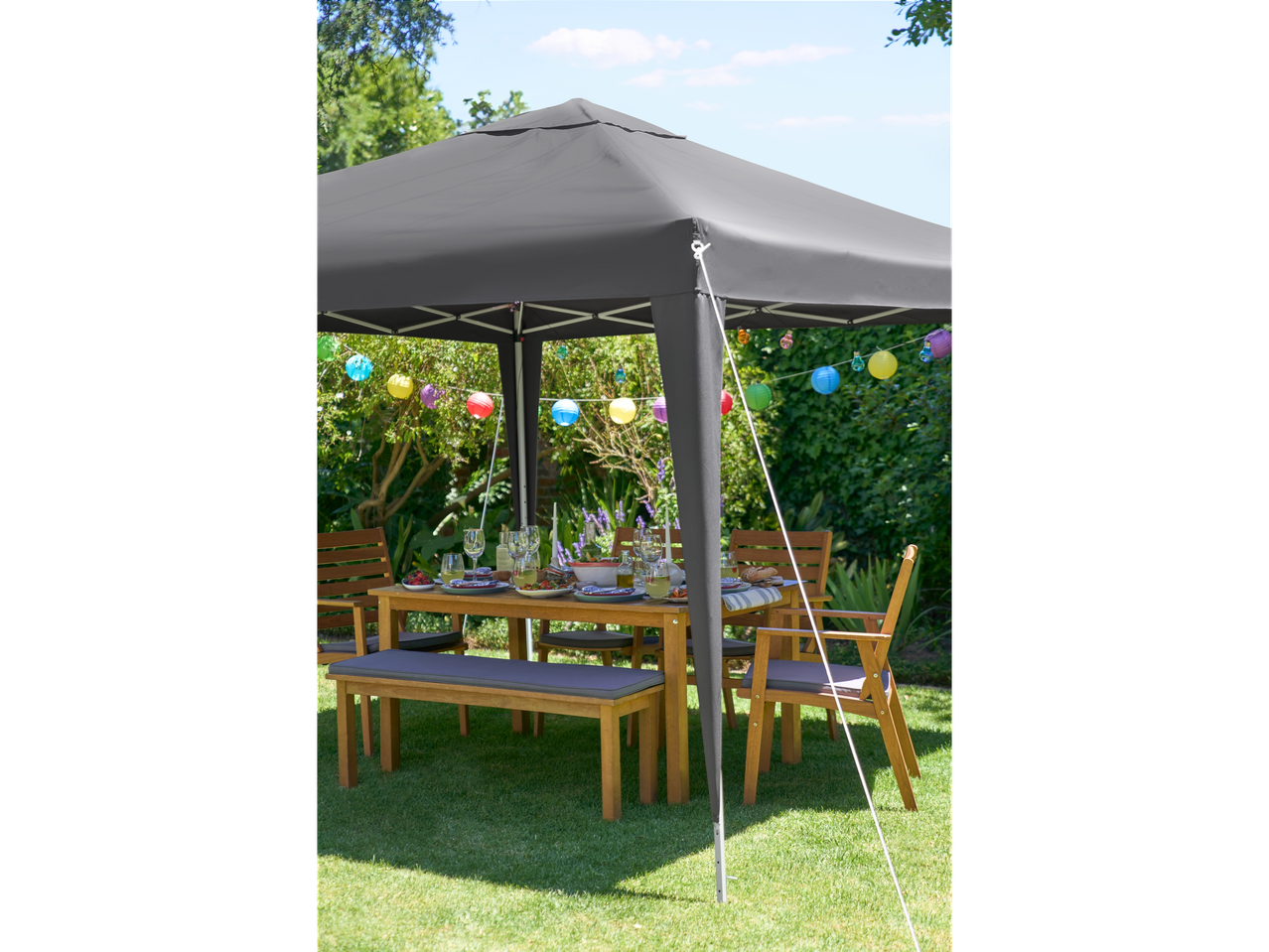 Garden gazebo, garden furniture, and colorful lanterns.