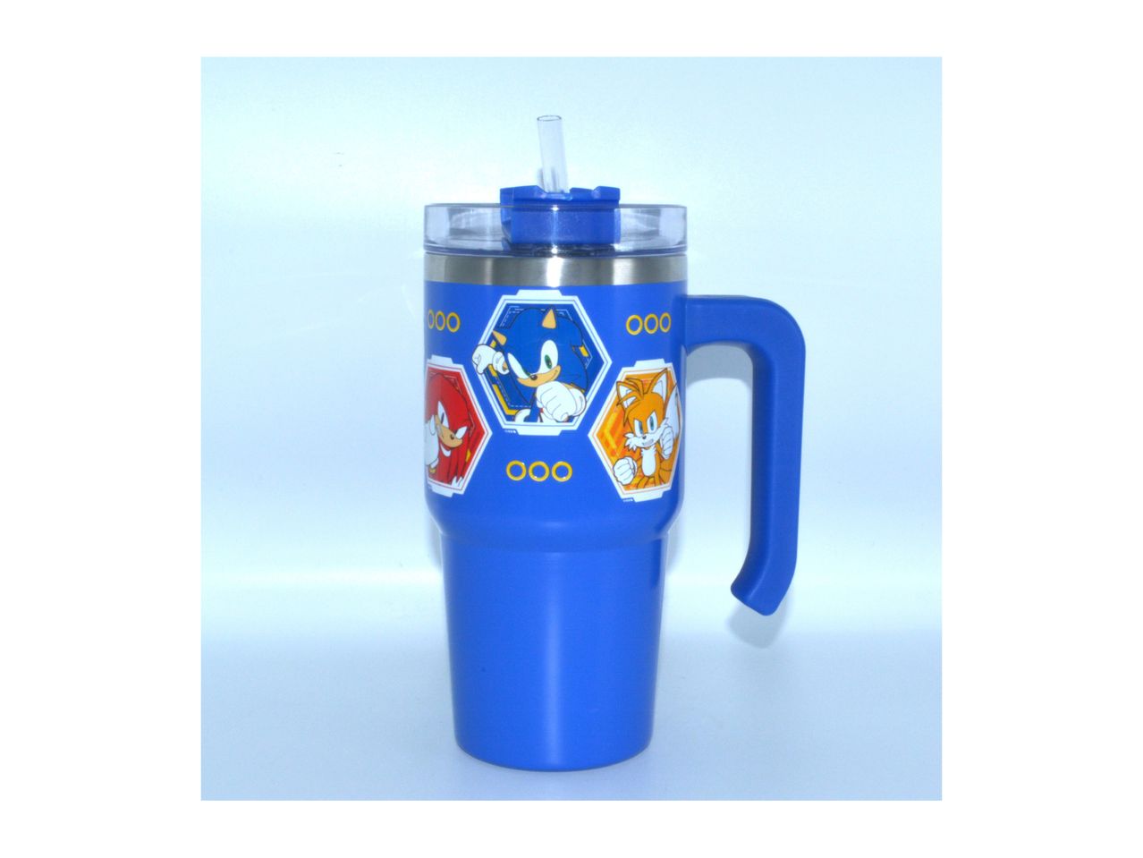 A blue stainless steel travel mug with a handle and straw, featuring colorful hexagons.