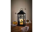 LIVARNO home LED Halloween Lantern with raven cutouts, surrounded by pumpkins and spiderwebs.