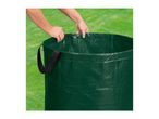 Hands adjusting the drawstring of a green garden waste bag on a lawn.