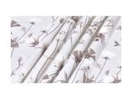 White fabric with a delicate brown floral pattern, draped in soft folds.