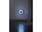 LIVARNO home LED Night Light plugged into a wall socket, illuminating the floor.