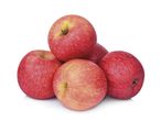 Four ripe red apples.