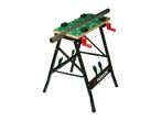 A black and green workbench with a metal bar clamped on top, featuring red handles.
