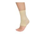 A person's foot and lower leg wearing a beige ankle support sleeve.