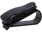 Un supporto per occhiali da sole per auto, nero, in plastica.