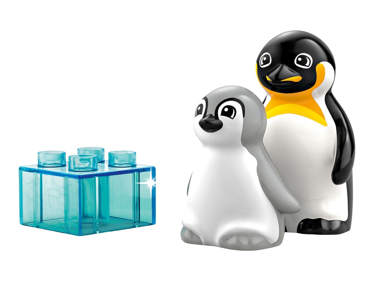 Two penguin figures, one adult and one baby, next to a transparent blue building block.