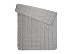 Grey quilted weighted blanket with folded top corner