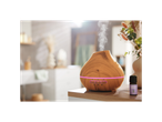 Wooden essential oil diffuser and lavender oil bottle.