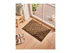 A brown doormat with black polka dots and an umbrella design, with sandals nearby.