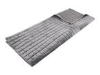 Grey quilted weighted blanket folded on a white background