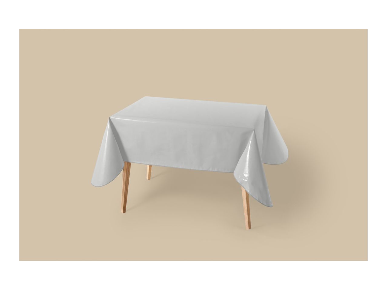 A light grey tablecloth draped over a wooden table on a beige background.
