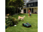 PARKSIDE® 20V Robot Lawn Mower on a lawn with a family and dog