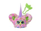 A colorful Furby toy with a green hair clip on a white background.