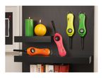 Colorful utility lighters displayed on shelves with candles and books.