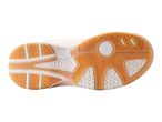 White athletic shoes with an orange sole.