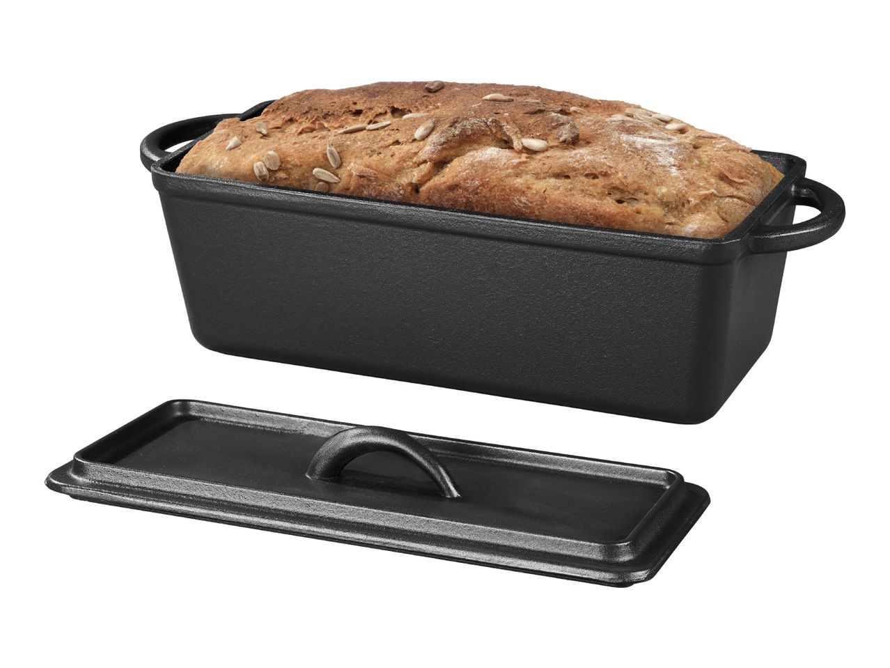 Freshly baked bread with sunflower seeds in a black cast iron loaf pan with lid.