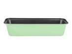 Light green loaf pan with a dark non-stick interior.