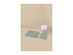 Two green striped bath mats on a light brown floor in front of a white toilet.