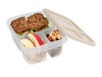 A clear plastic lunchbox with compartments holds sandwiches, apple slices, and nuts.