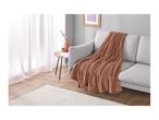 A cozy living room with a light gray sofa draped with a soft brown blanket.