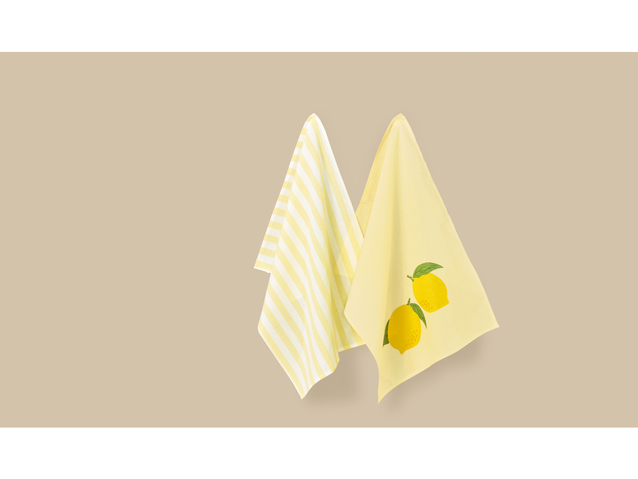 Dve žute kuhinjske krpe: jedna na pruge, druga sa printom limuna.