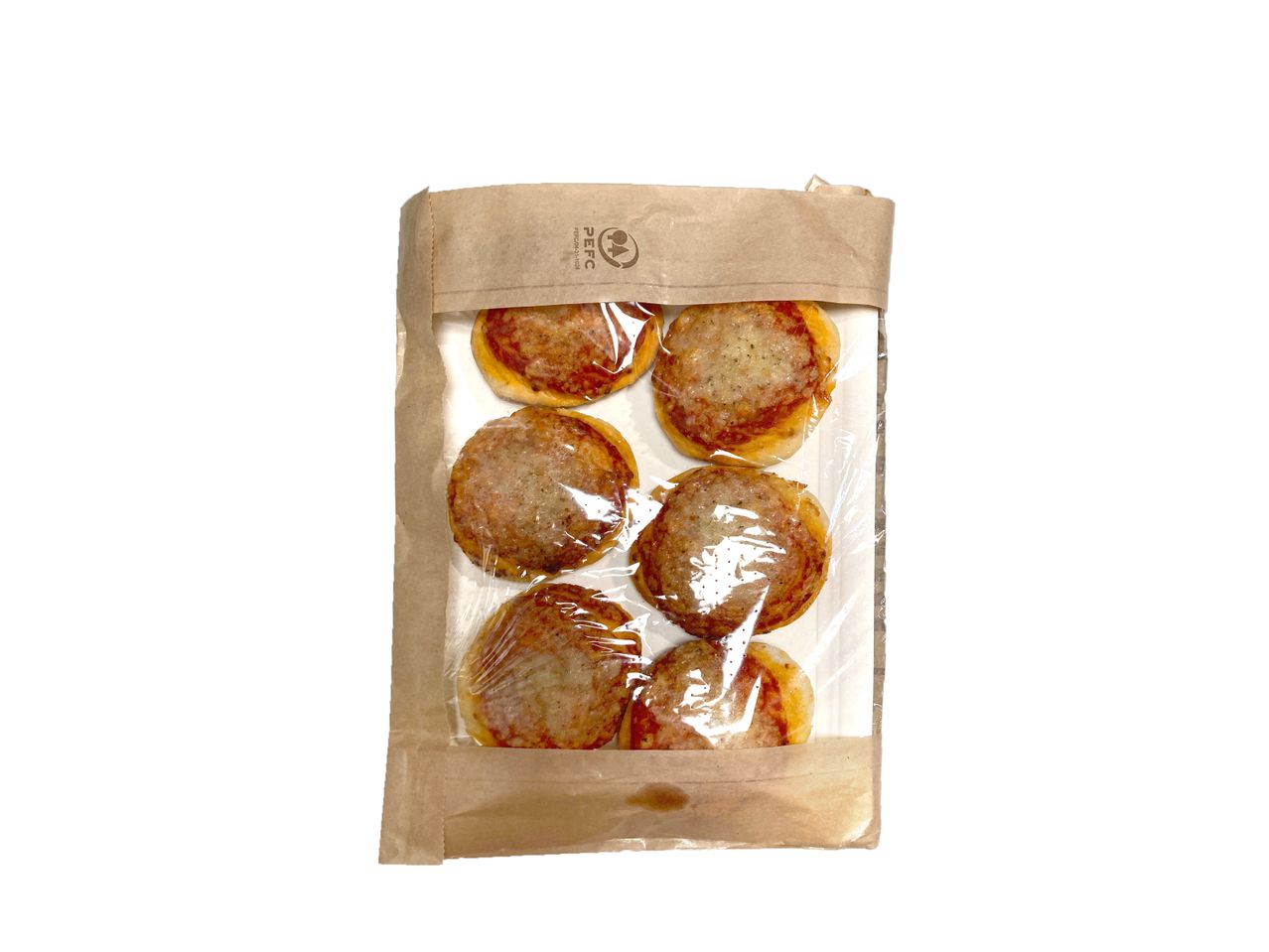 Six mini pizzas in a paper bag and plastic wrap.