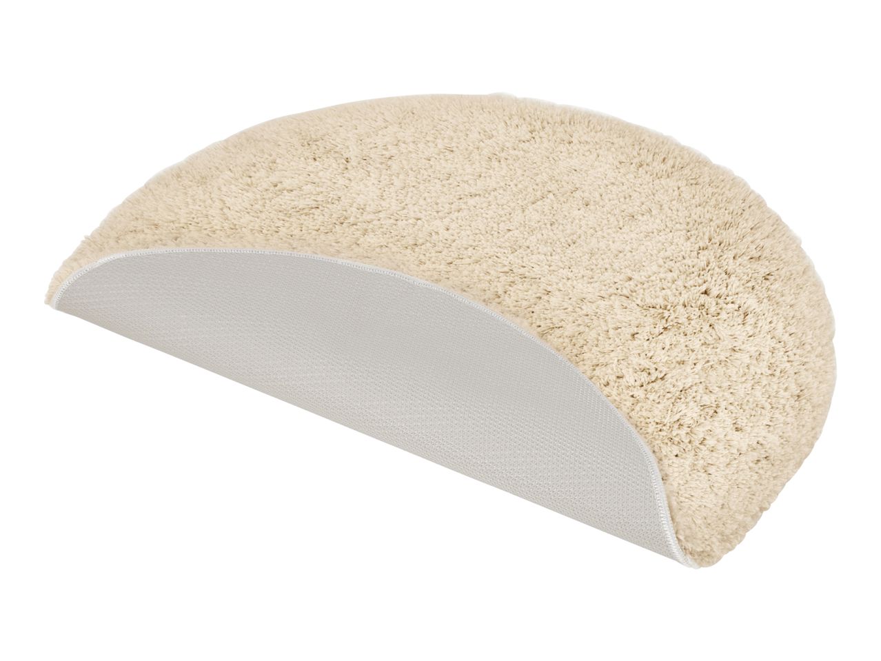 Cream-colored half-round bath mat with a non-slip backing, partially folded to show texture.