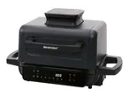 Black electric grill with digital display and handles on a white background.