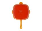 Orange square cast iron pan with a handle, showing care symbols and 'SILVERCREST' brand.