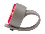 Red LED bicycle rear light with a grey silicone strap, illuminated.