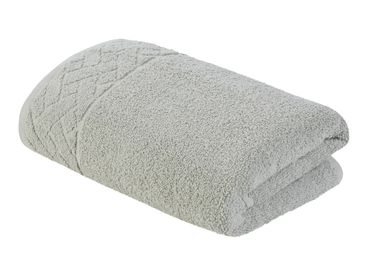 A rolled-up, light gray bath towel.