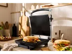 SILVERCREST® Panini Grill with a grilled sandwich in a kitchen setting.