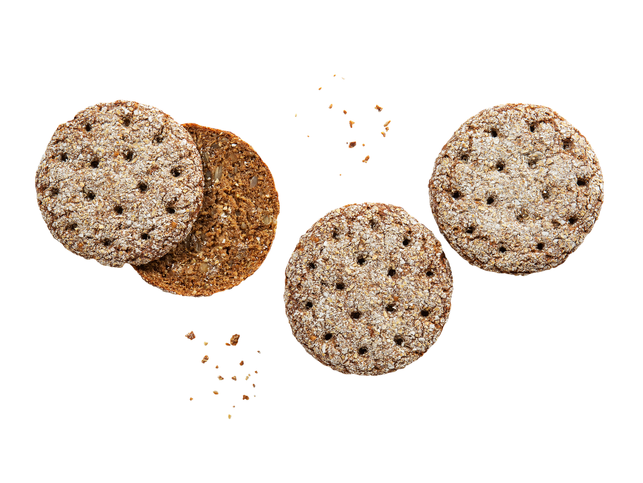 Pyöreitä, kuitupitoisia näkkileipiä ja siemennäkkileipä mustalla taustalla.