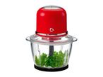 Red electric food chopper with glass bowl containing fresh parsley