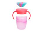 Disassembled pink and red sippy cup with handles and a colorful striped lid