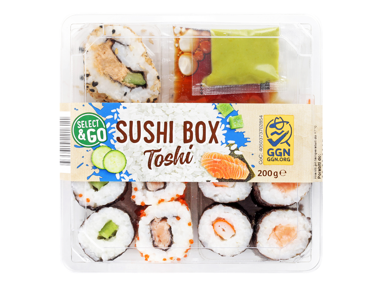 Škatla sušija z različnimi zvitki, omakami in napisom 'SUSHI BOX Toshi'.