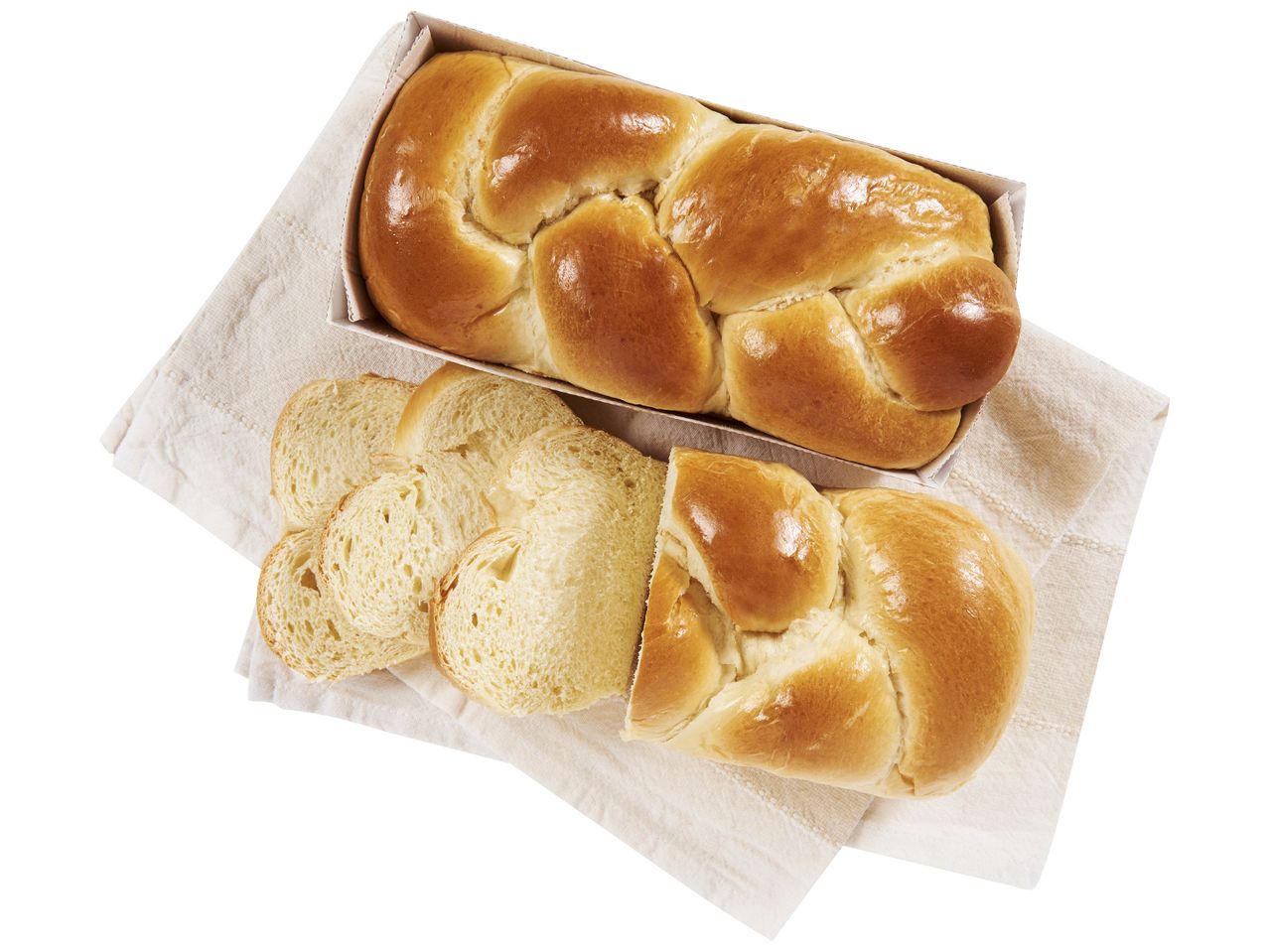 Petits pains et pain tranché sur un tissu.