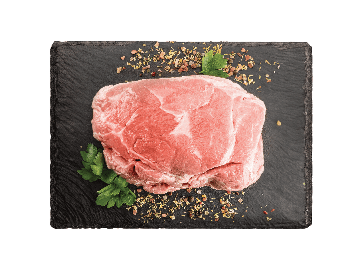 Žalia mėsa ant tamsaus skalūno su prieskoniais ir petražolėmis.