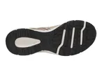 Underside of a beige and black athletic shoe with a textured sole.
