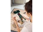 A person uses Parkside wire strippers on an electrical cable.