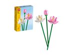 A box of building block lotus flowers and three assembled building block lotus flowers.