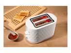White two-slice toaster with a textured pattern, shown next to toast and jam on a wooden table.