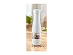 Electric salt or pepper mill on a wooden kitchen countertop