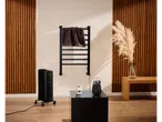 Toalheiro elétrico Tronic® com radiador e aquecedor portátil num quarto moderno