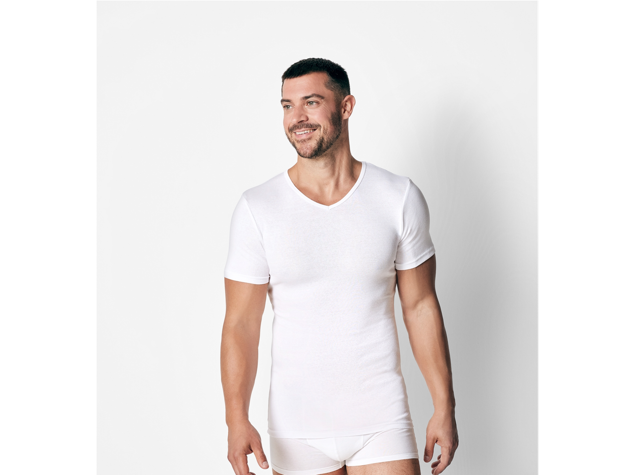 Man in a white v-neck Fine-Ribbed Undershirts and underwear.