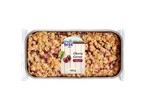 Cherry crumble cake in a foil tray, with a label showing cherries and text 'Cherry Cereza'